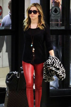 Ashley Tisdale arriving at LAX airport with Martin Johnson