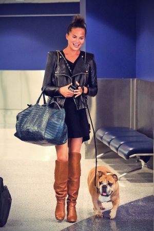 Chrissy Teigen is seen arriving at LAX airport