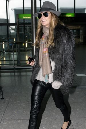 Elle Macpherson at Heathrow Airport in London