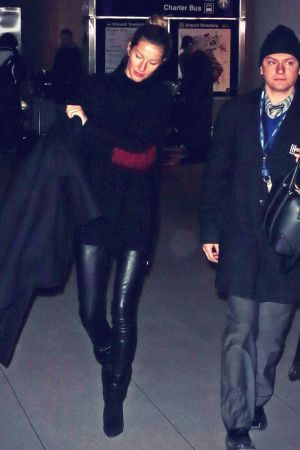 Gisele Bundchen is seen as she arrives at Logan International Airport