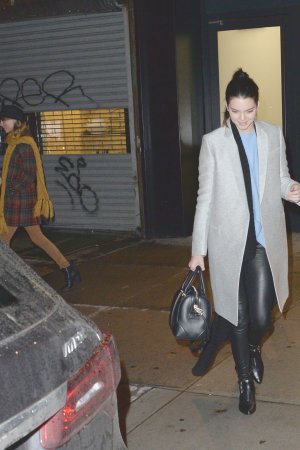 Kendall Jenner, Taylor Swift and Cara Delevingne coming out of Gigi Hadids house