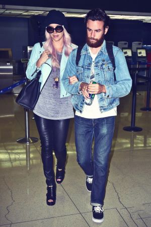 Kesha arrives on an international flight at LAX Airport