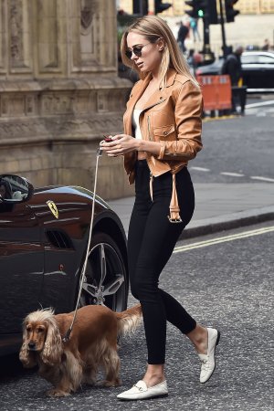 Kimberley Garner driving her Ferrari