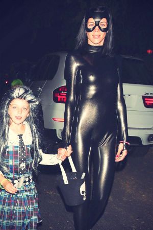 Liberty Ross dresses up as Catwoman while trick-or-treating