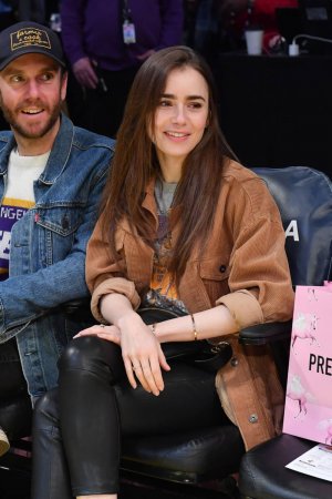 Lily Collins at a Los Angeles Lakers game