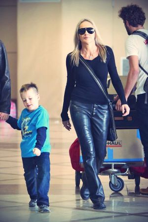 Sharon Stone And Family Departing On A Flight At LAX