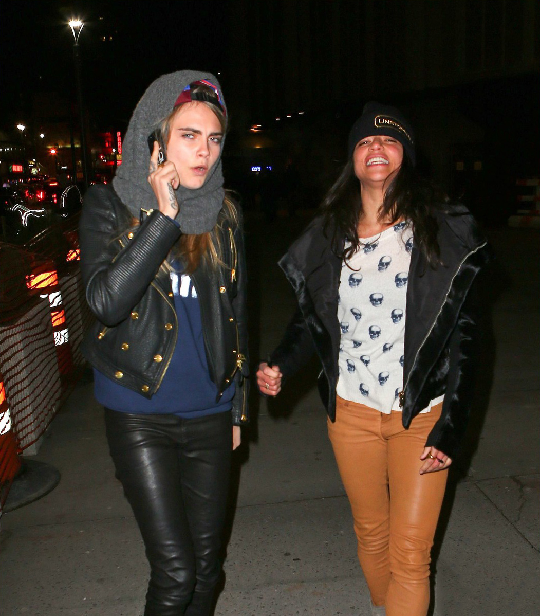 Cara Delevingne leans in for a smooch with Michelle Rodriguez