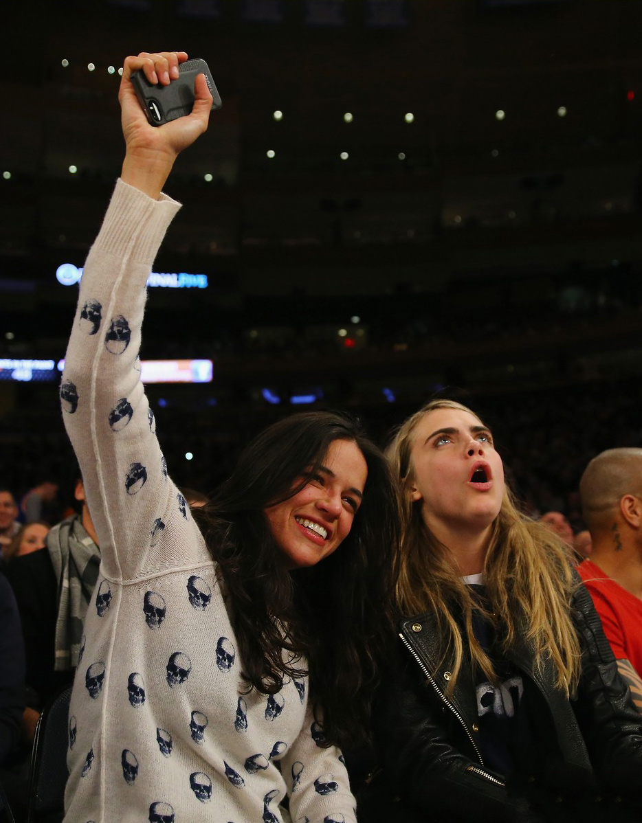 Cara Delevingne leans in for a smooch with Michelle Rodriguez