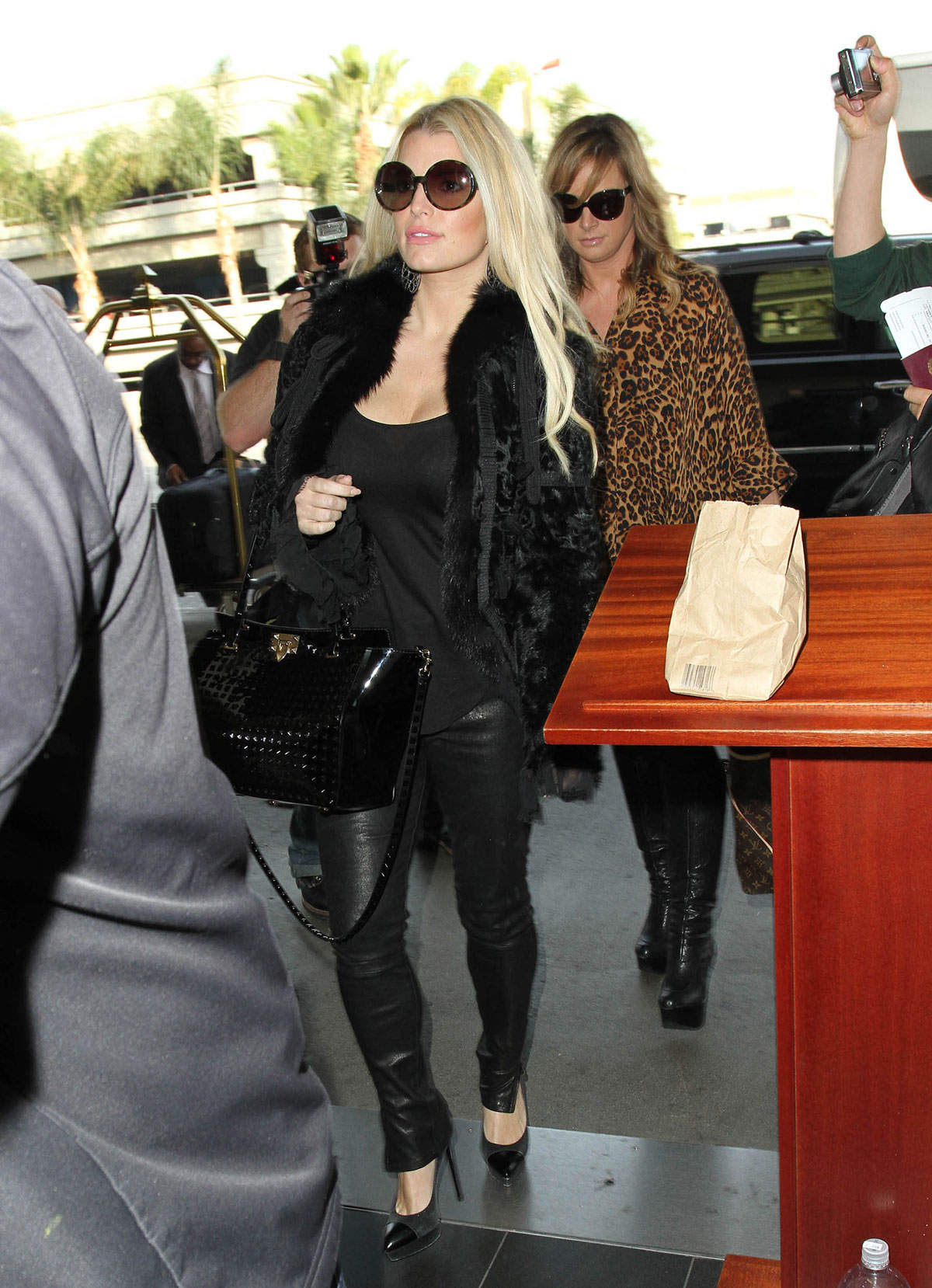 Jessica Simpson all smiles as she arrives at LAX