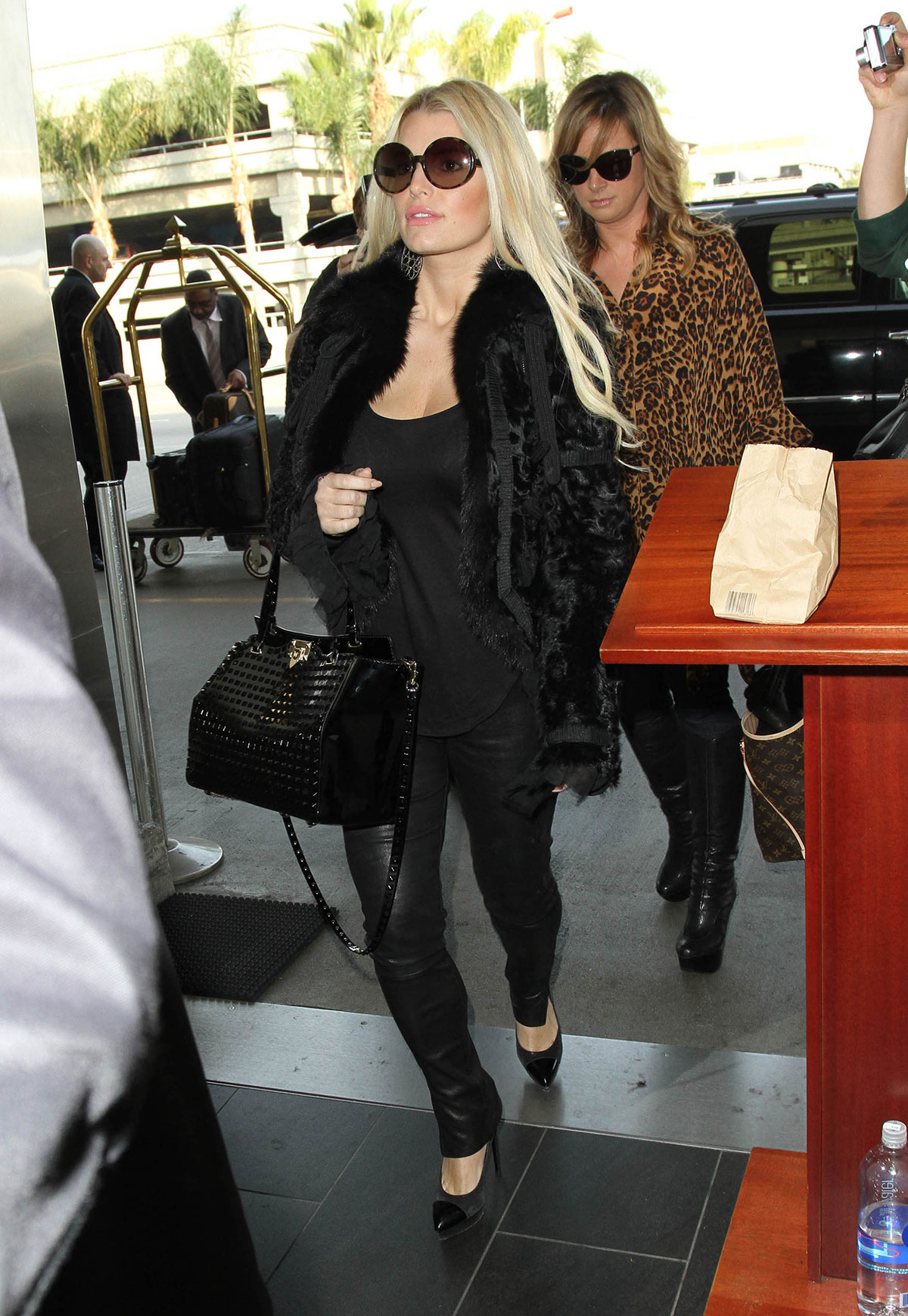 Jessica Simpson all smiles as she arrives at LAX