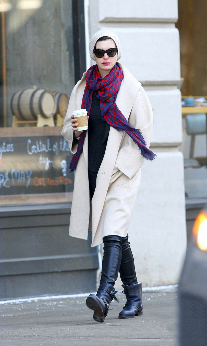 Anne Hathaway picks up a coffee in the SoHo neighborhood