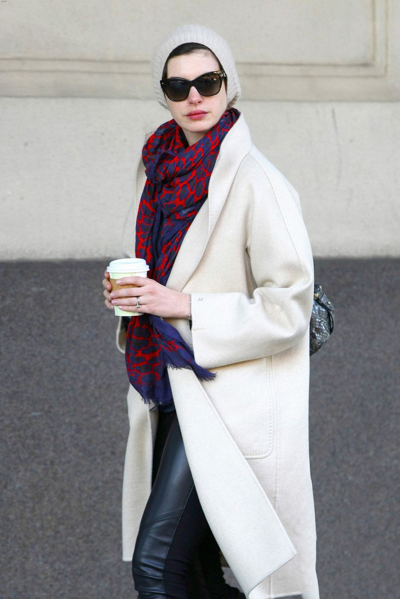 Anne Hathaway picks up a coffee in the SoHo neighborhood