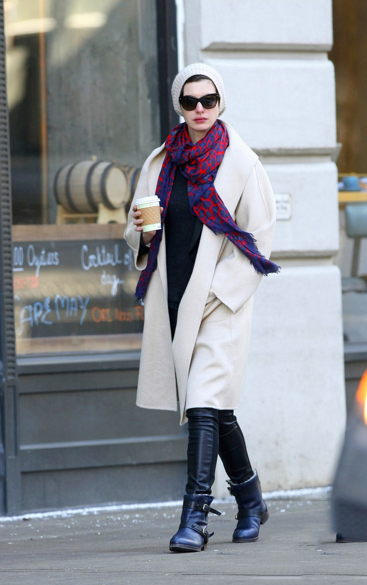 Anne Hathaway picks up a coffee in the SoHo neighborhood