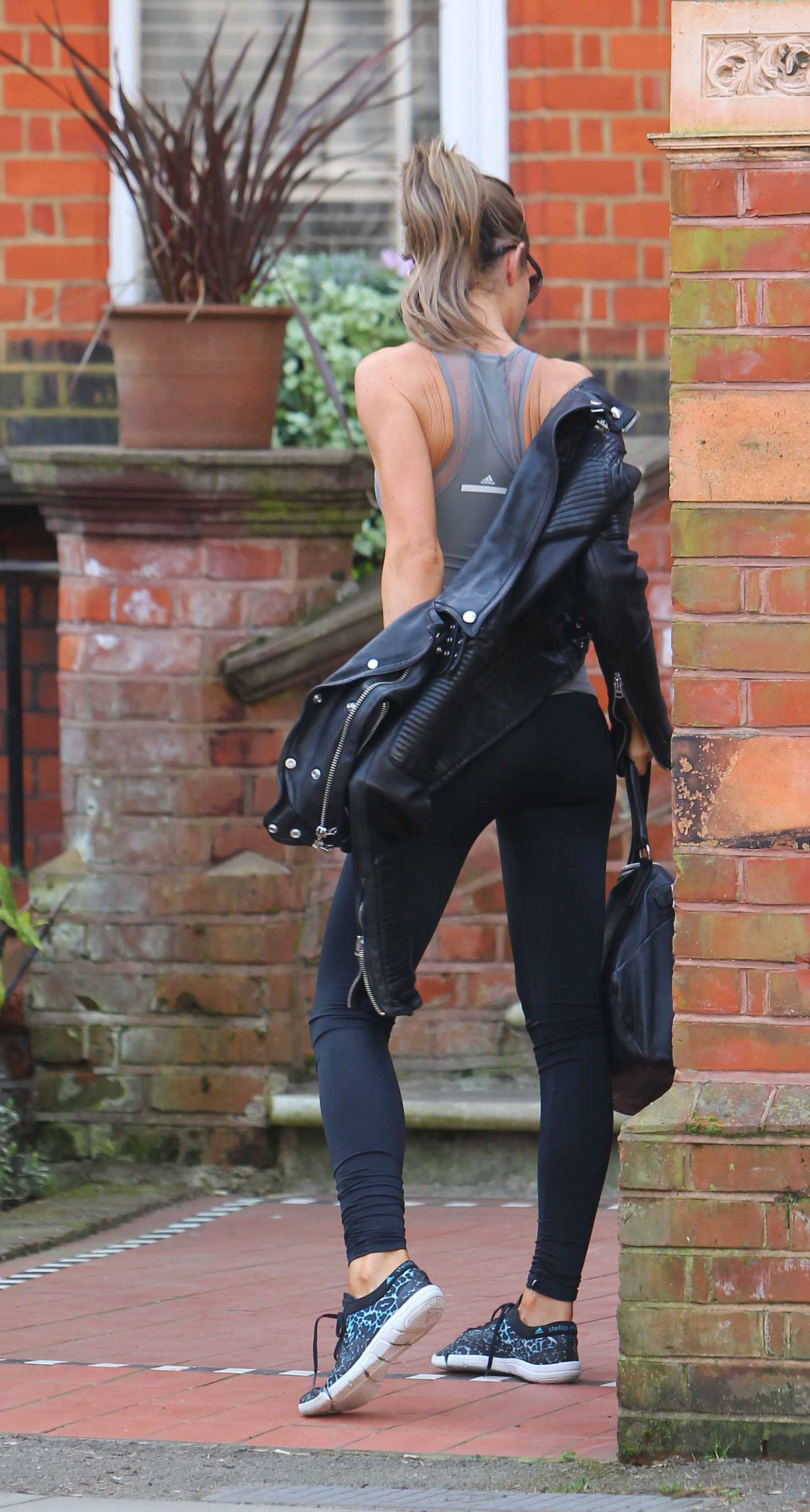 Abbey Clancy leaves her central London home to go to the gym