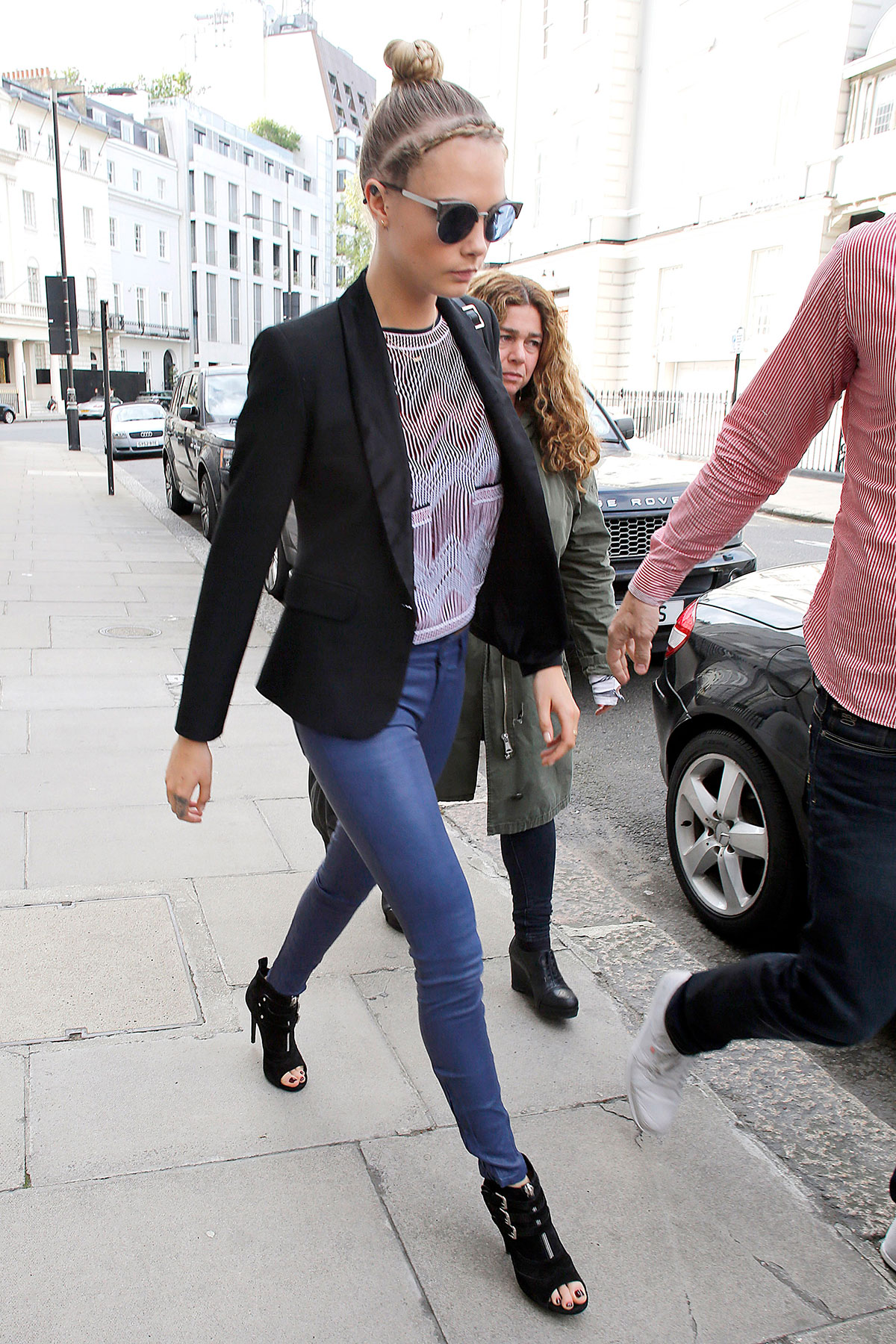Cara Delevingne seen leaving home and heads to a London hotel