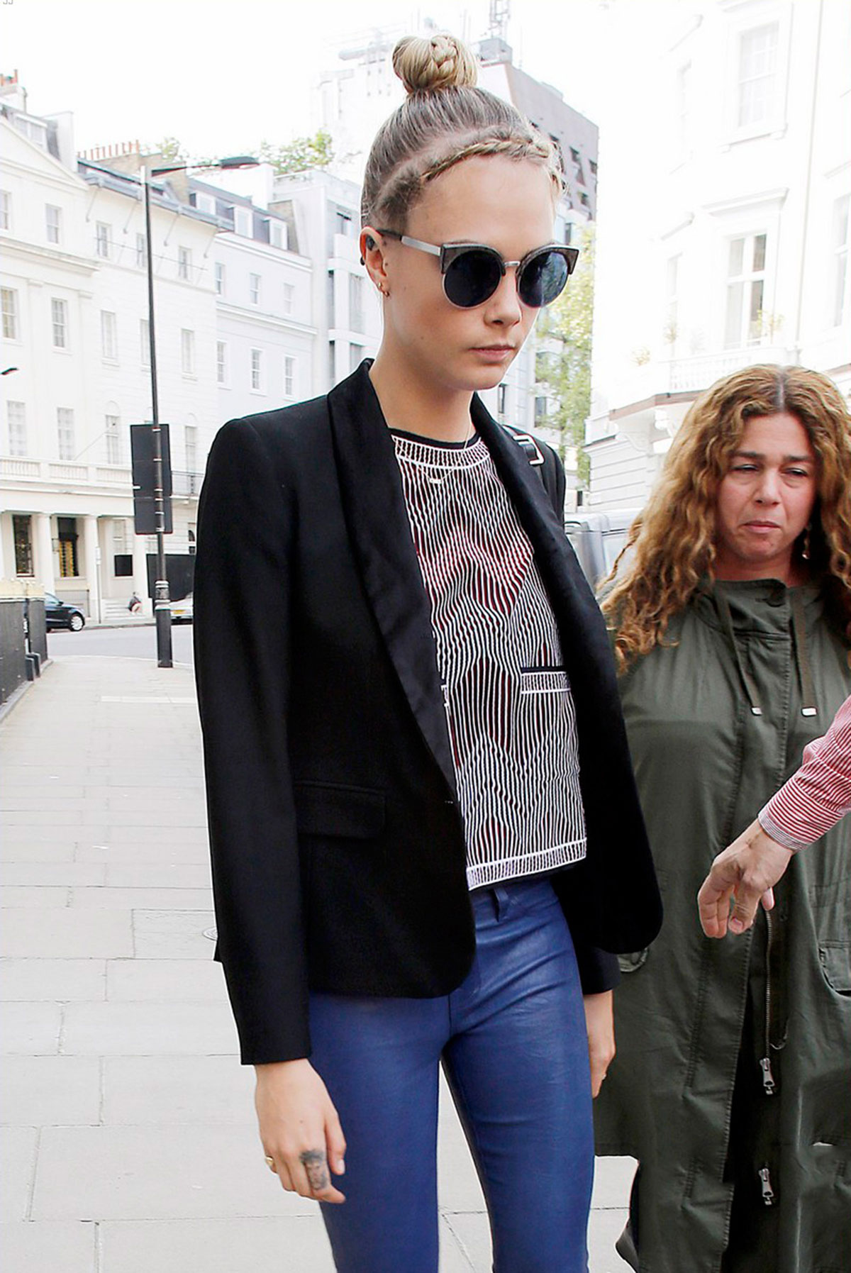 Cara Delevingne seen leaving home and heads to a London hotel