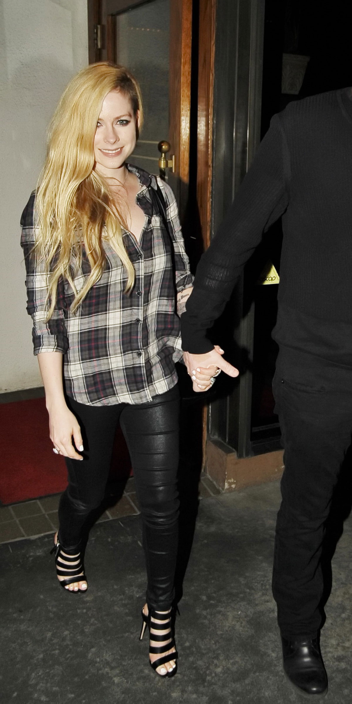 Avril Lavigne leaving Madeo Restaurant