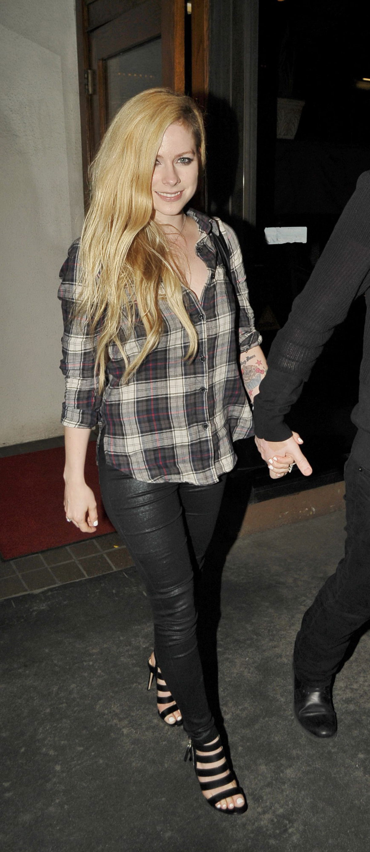 Avril Lavigne leaving Madeo Restaurant