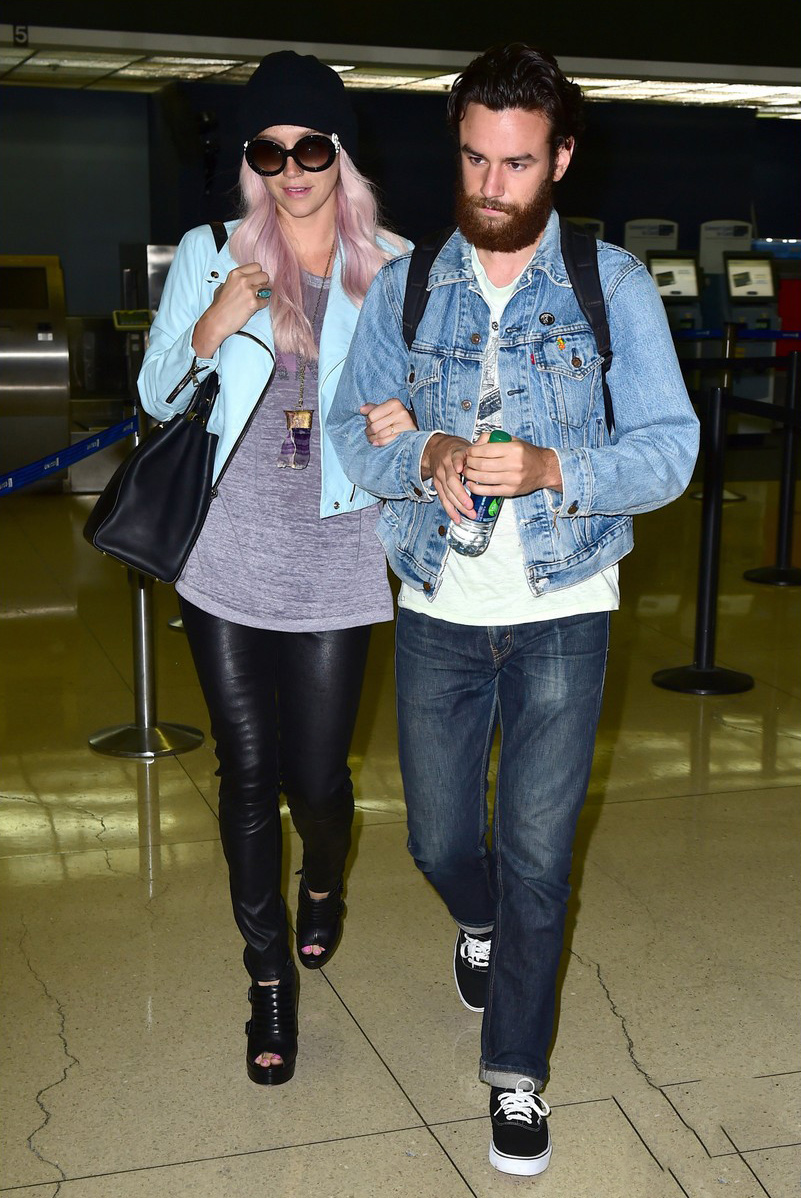 Kesha arrives on an international flight at LAX Airport