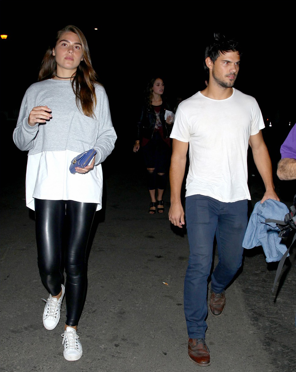 Marie Avgeropoulos and her boyfriend Taylor Lautner attend the Drake vs Lil Wayne concert