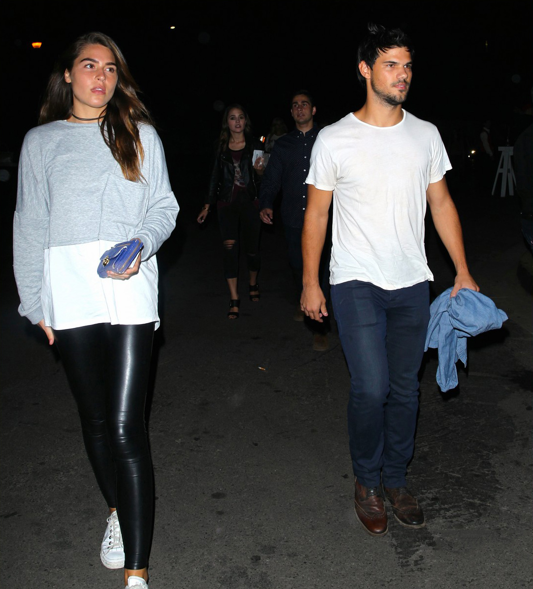 Marie Avgeropoulos and her boyfriend Taylor Lautner attend the Drake vs Lil Wayne concert
