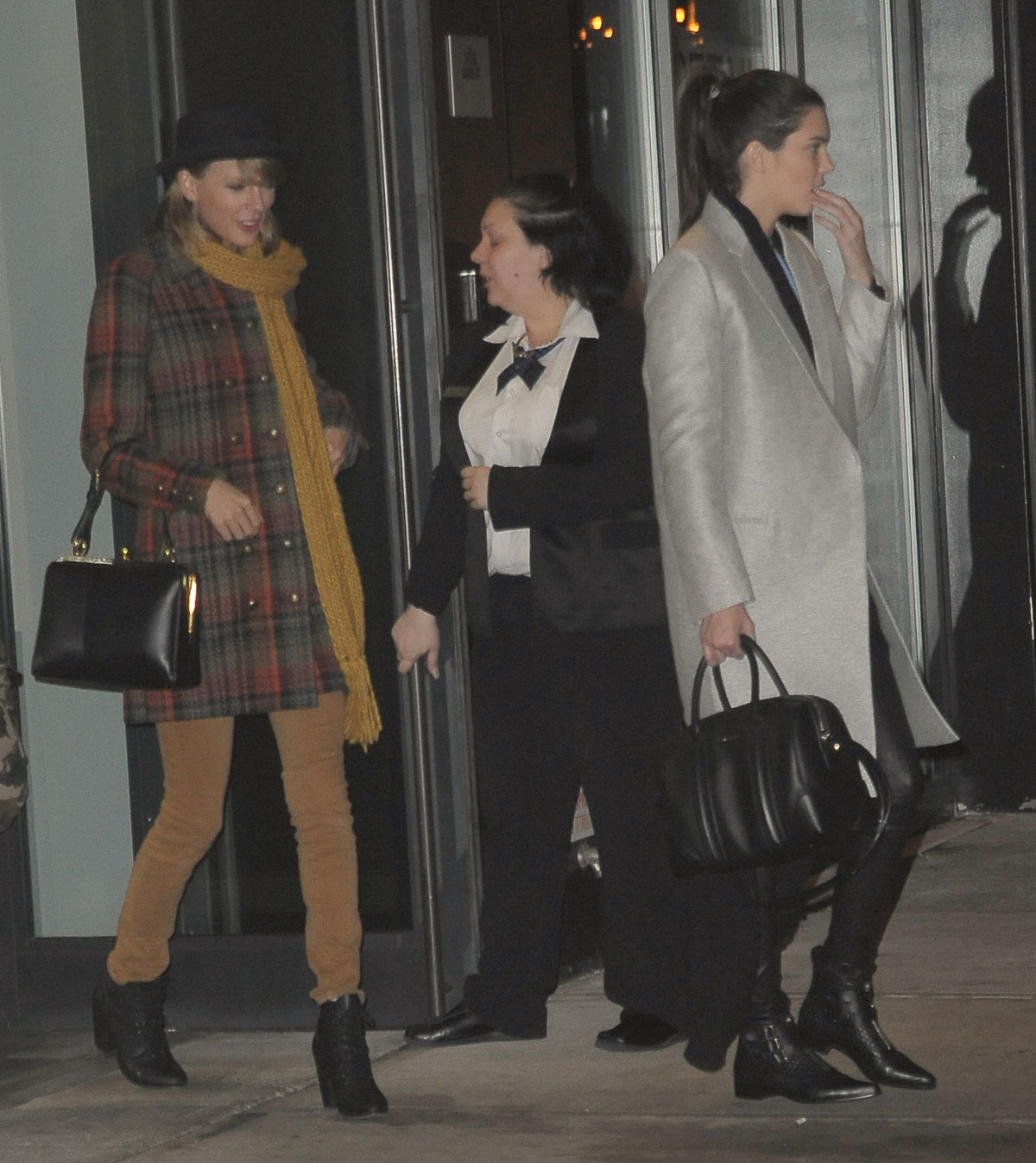 Kendall Jenner, Taylor Swift and Cara Delevingne coming out of Gigi Hadids house