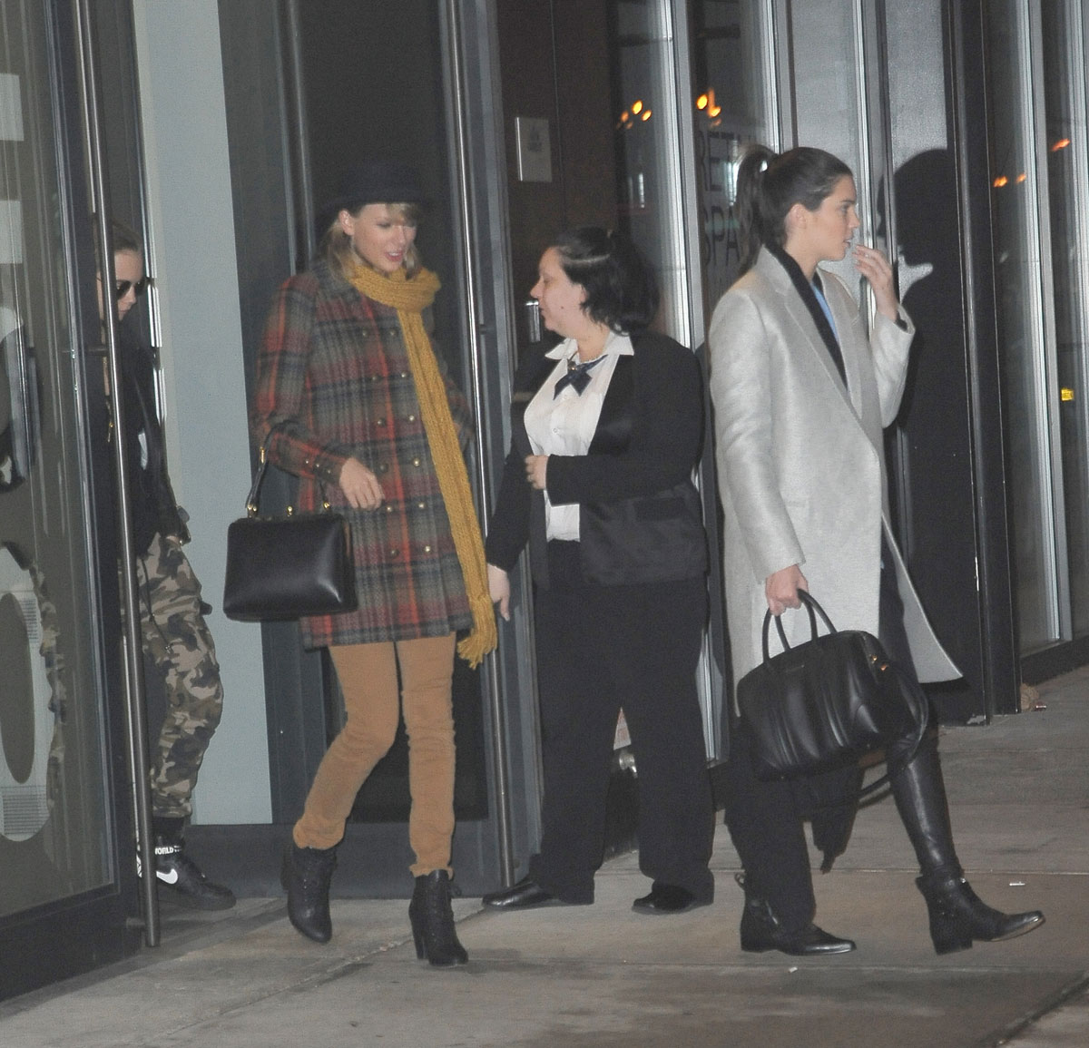 Kendall Jenner, Taylor Swift and Cara Delevingne coming out of Gigi Hadids house