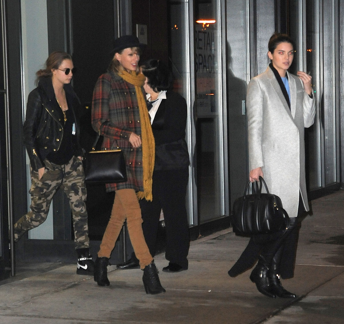 Kendall Jenner, Taylor Swift and Cara Delevingne coming out of Gigi Hadids house
