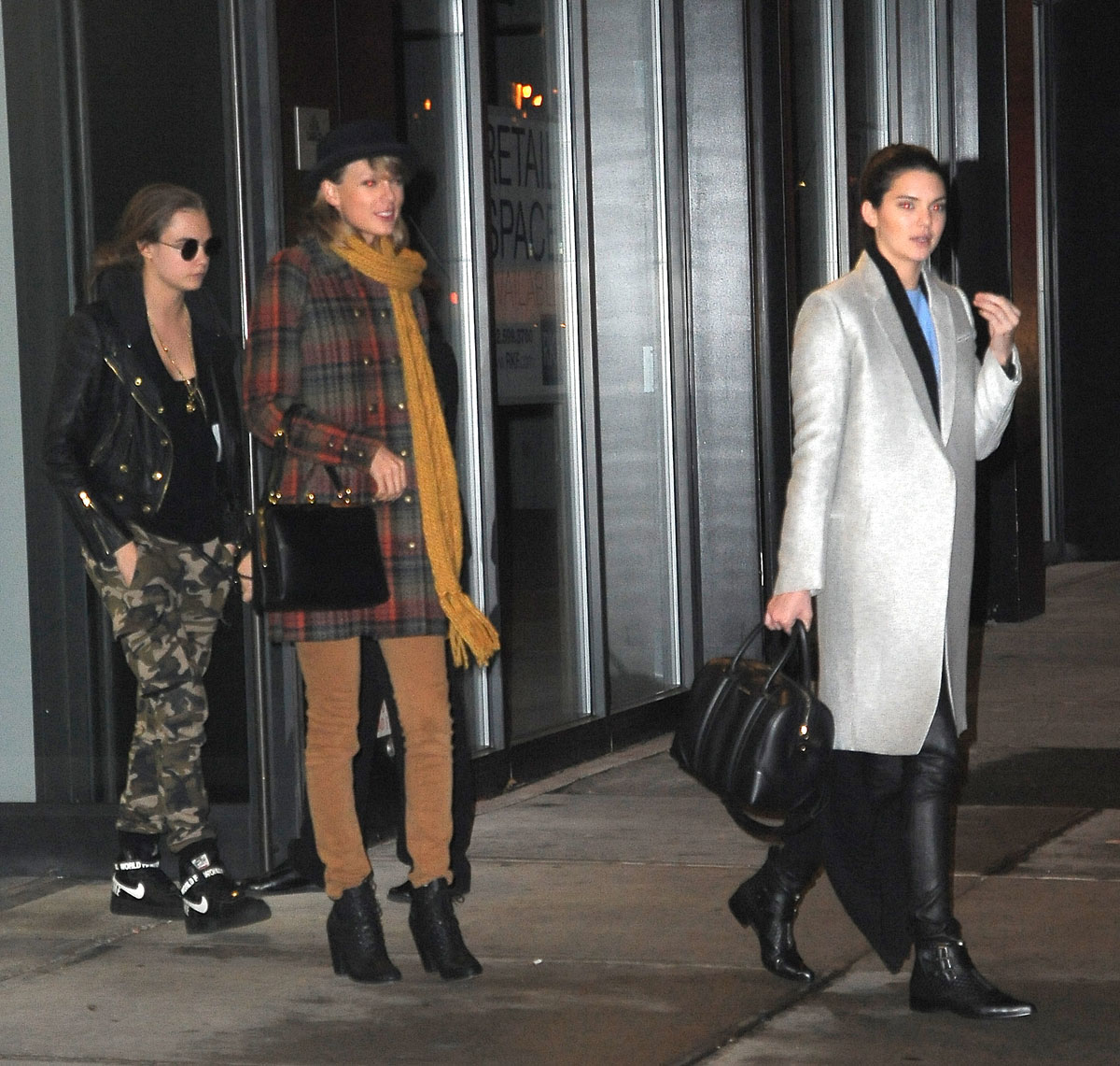 Kendall Jenner, Taylor Swift and Cara Delevingne coming out of Gigi Hadids house