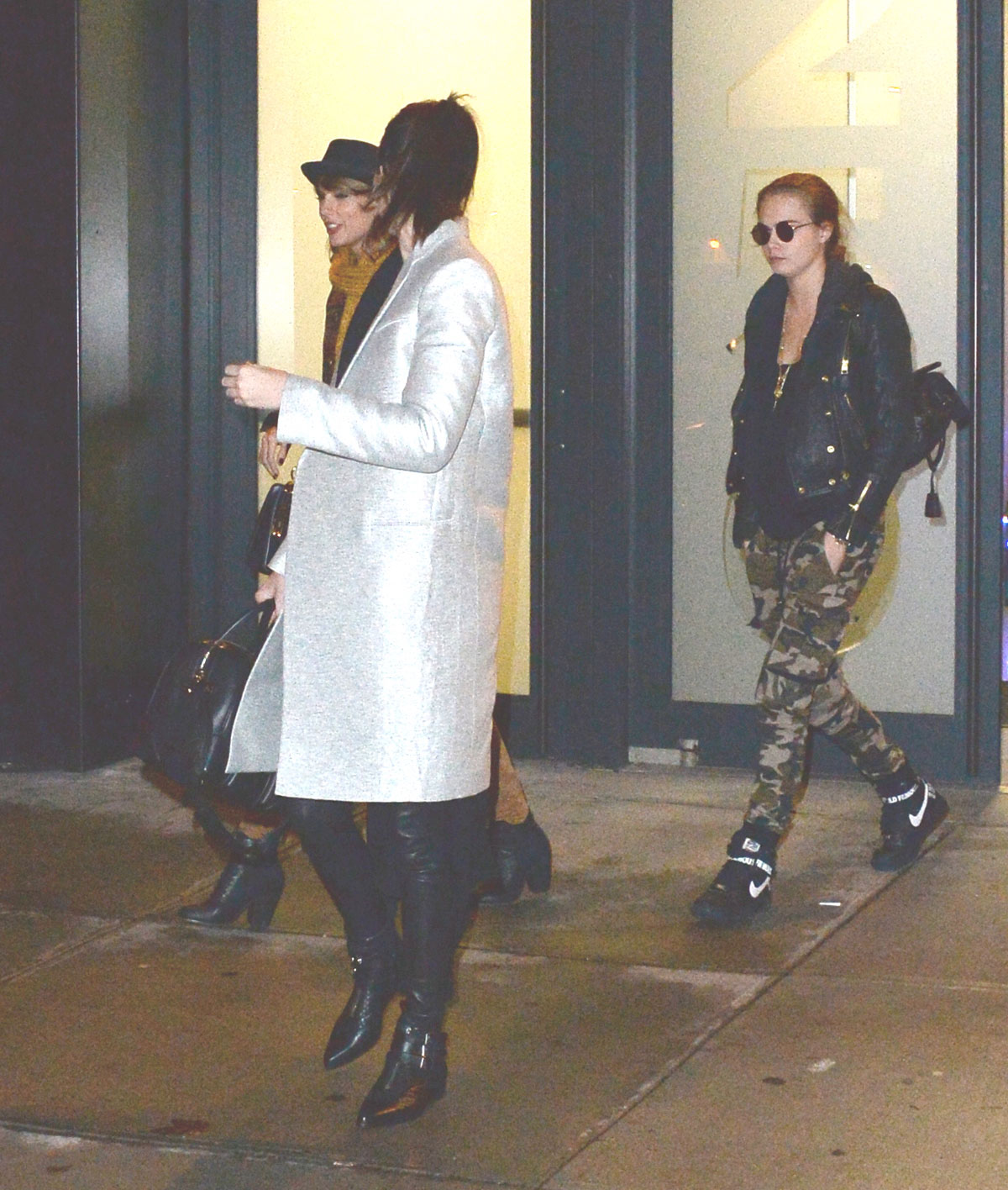 Kendall Jenner, Taylor Swift and Cara Delevingne coming out of Gigi Hadids house