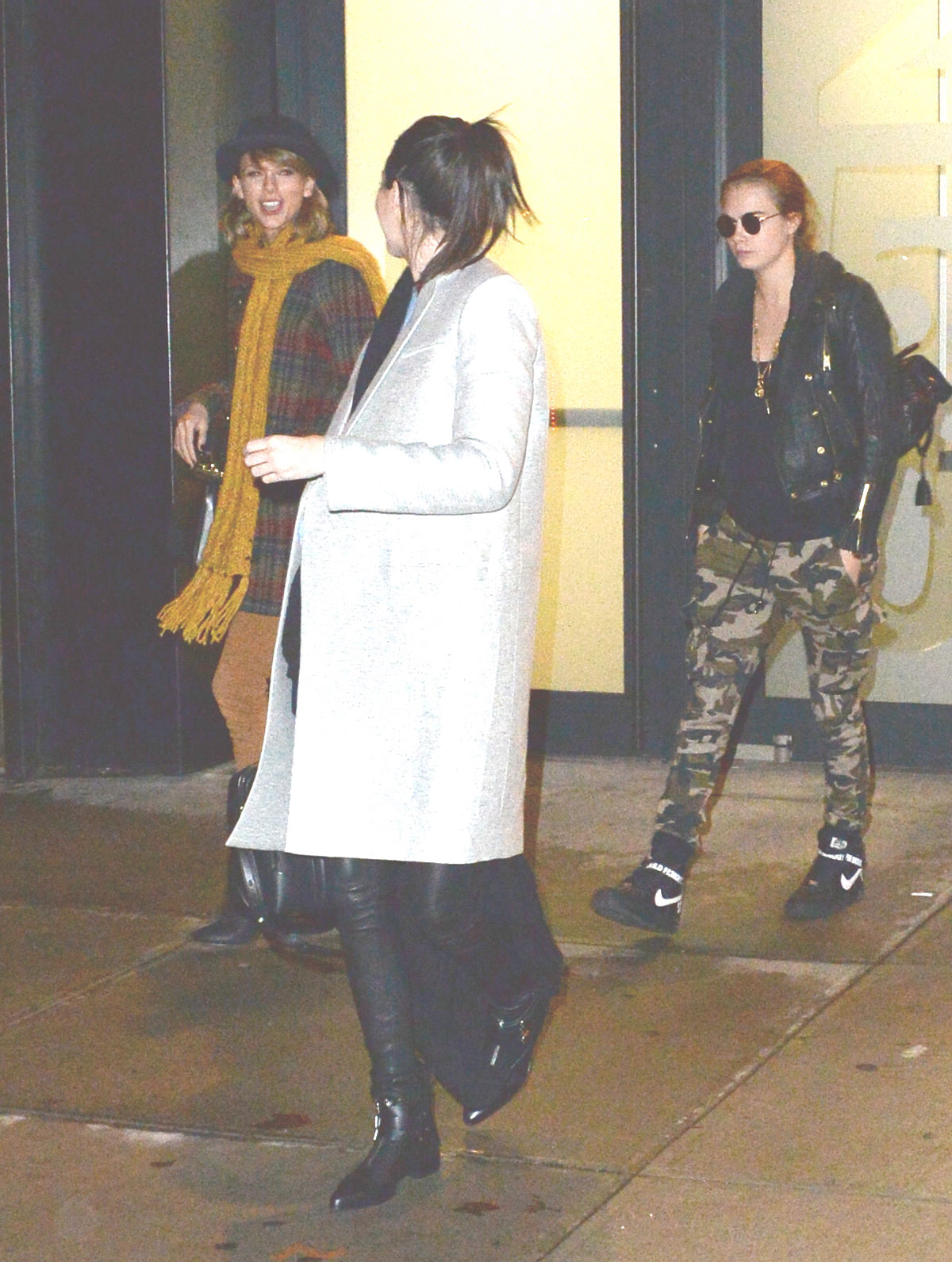 Kendall Jenner, Taylor Swift and Cara Delevingne coming out of Gigi Hadids house