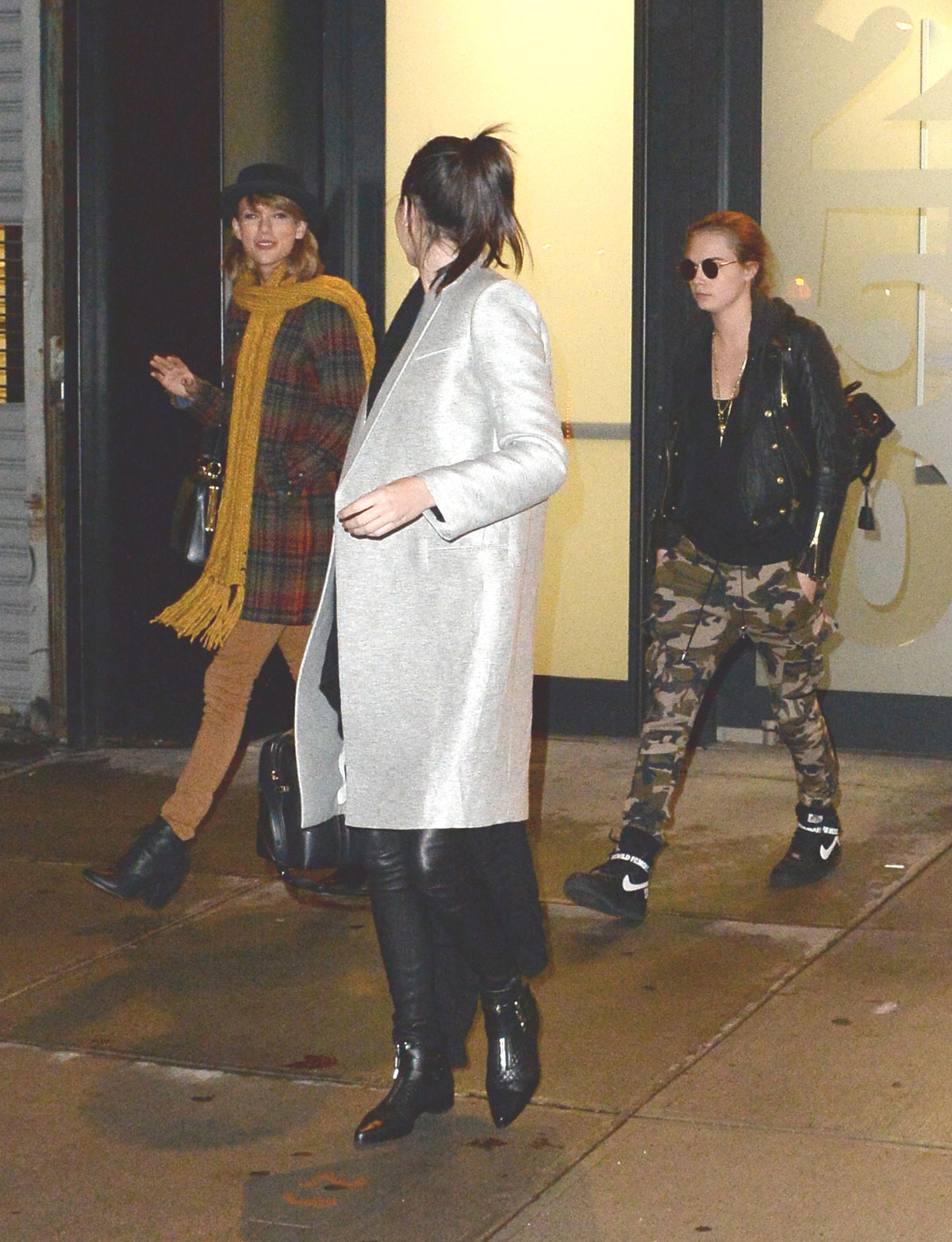 Kendall Jenner, Taylor Swift and Cara Delevingne coming out of Gigi Hadids house