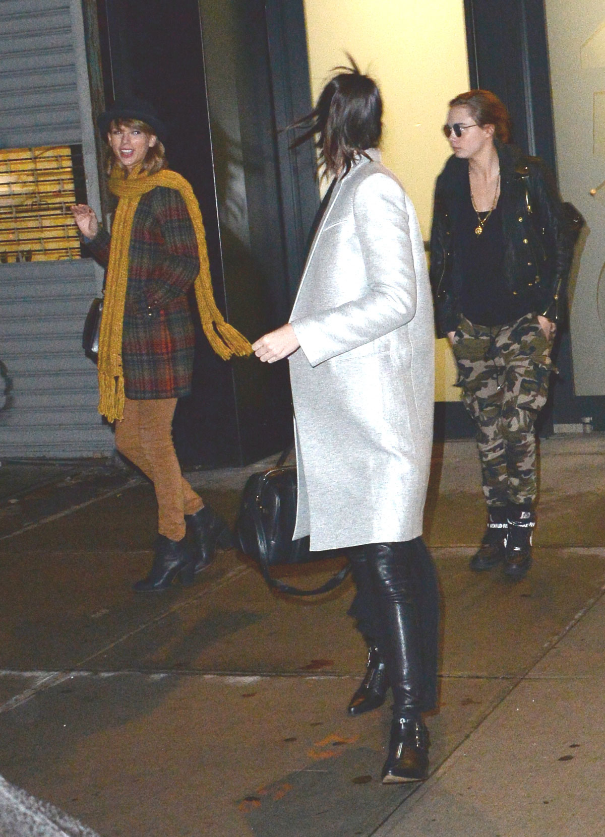 Kendall Jenner, Taylor Swift and Cara Delevingne coming out of Gigi Hadids house