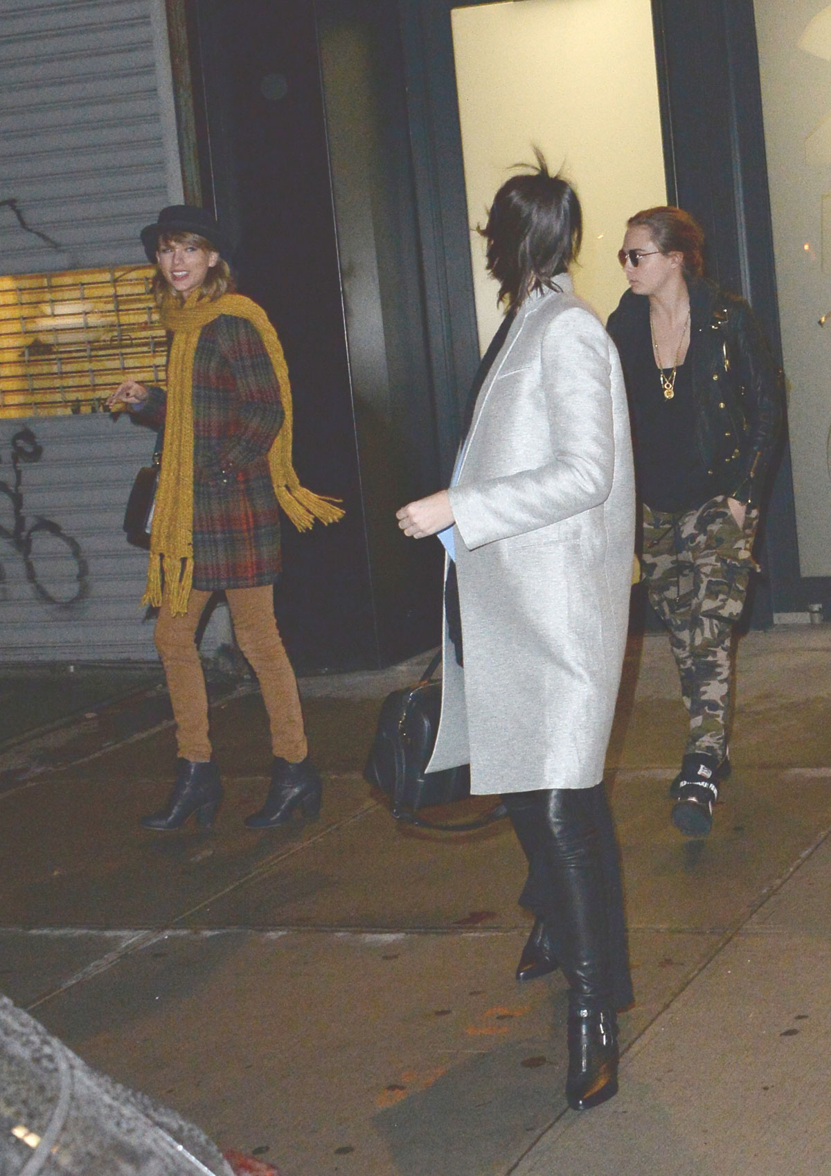 Kendall Jenner, Taylor Swift and Cara Delevingne coming out of Gigi Hadids house