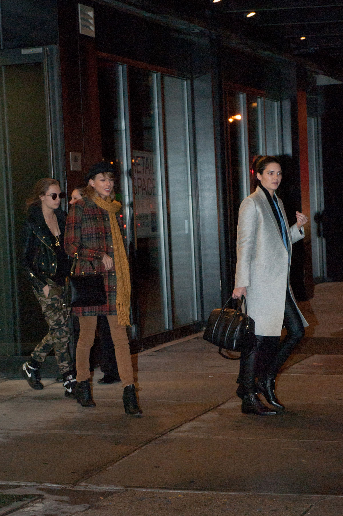 Kendall Jenner, Taylor Swift and Cara Delevingne coming out of Gigi Hadids house