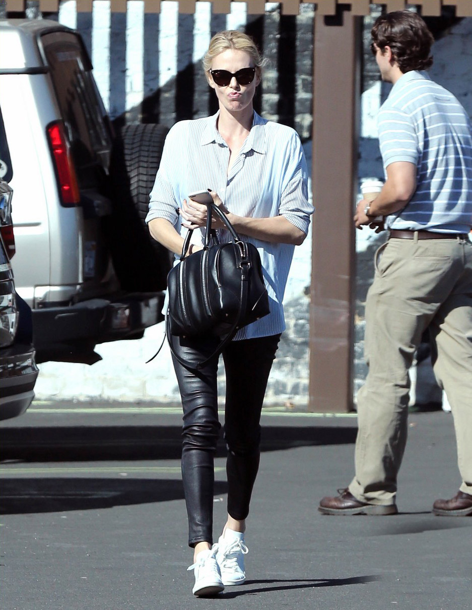 Charlize Theron exits a local restaurant