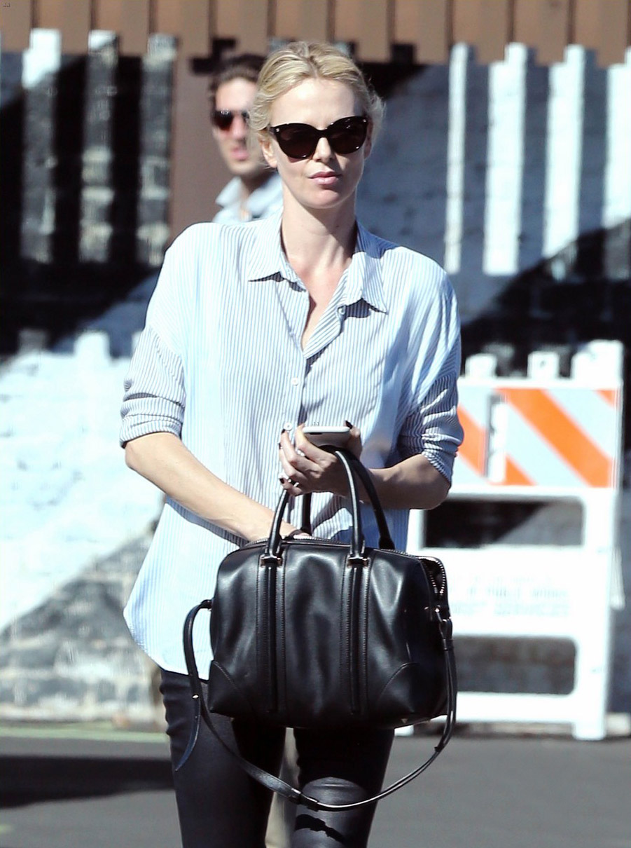 Charlize Theron exits a local restaurant