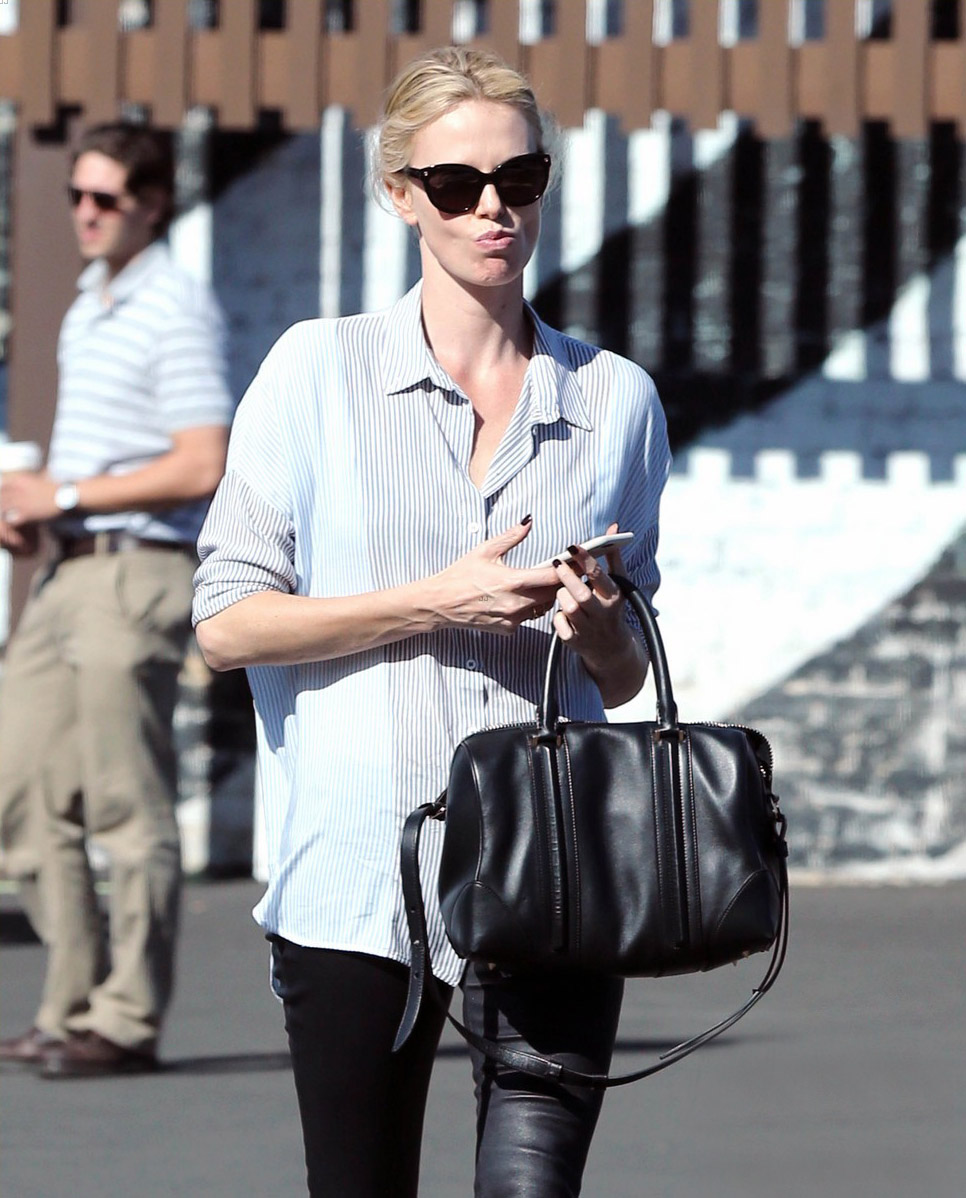 Charlize Theron exits a local restaurant