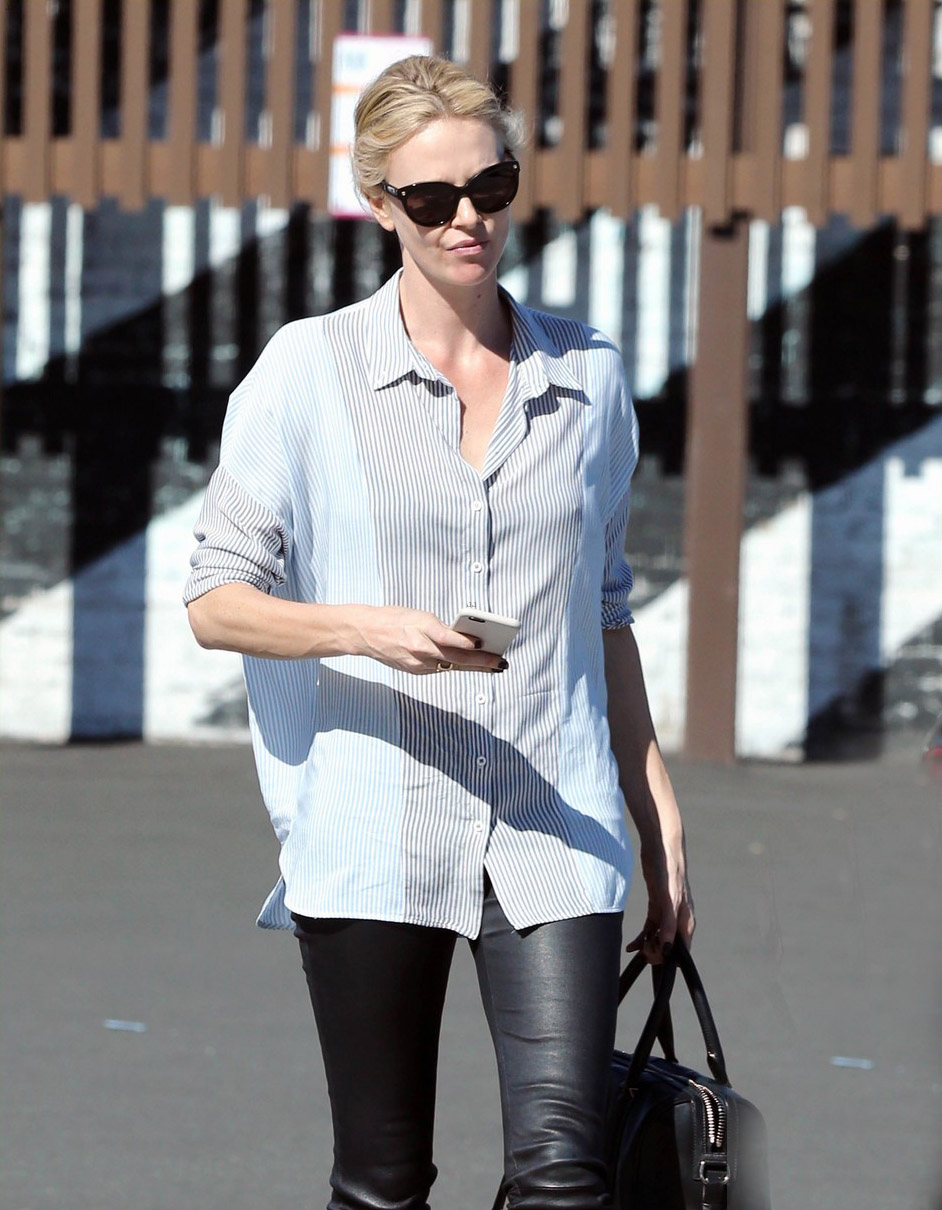 Charlize Theron exits a local restaurant