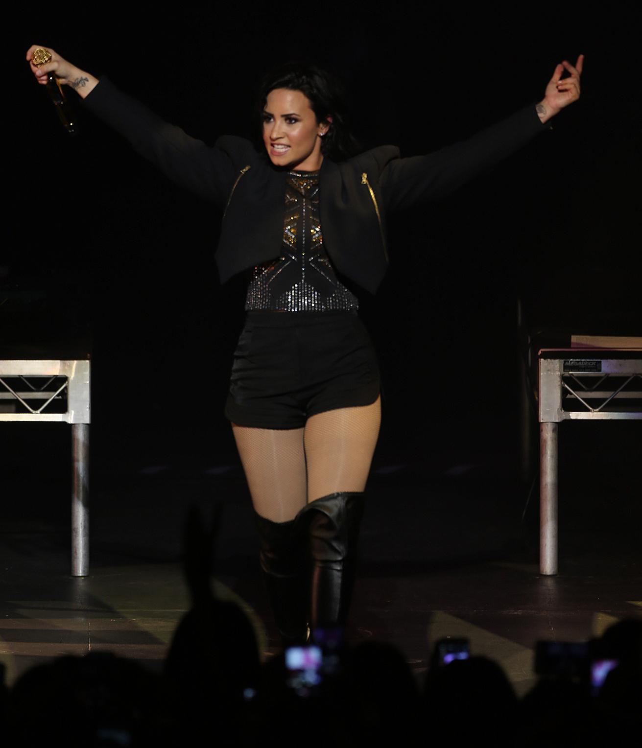 Demi Lovato performing at the Crowne Theatre