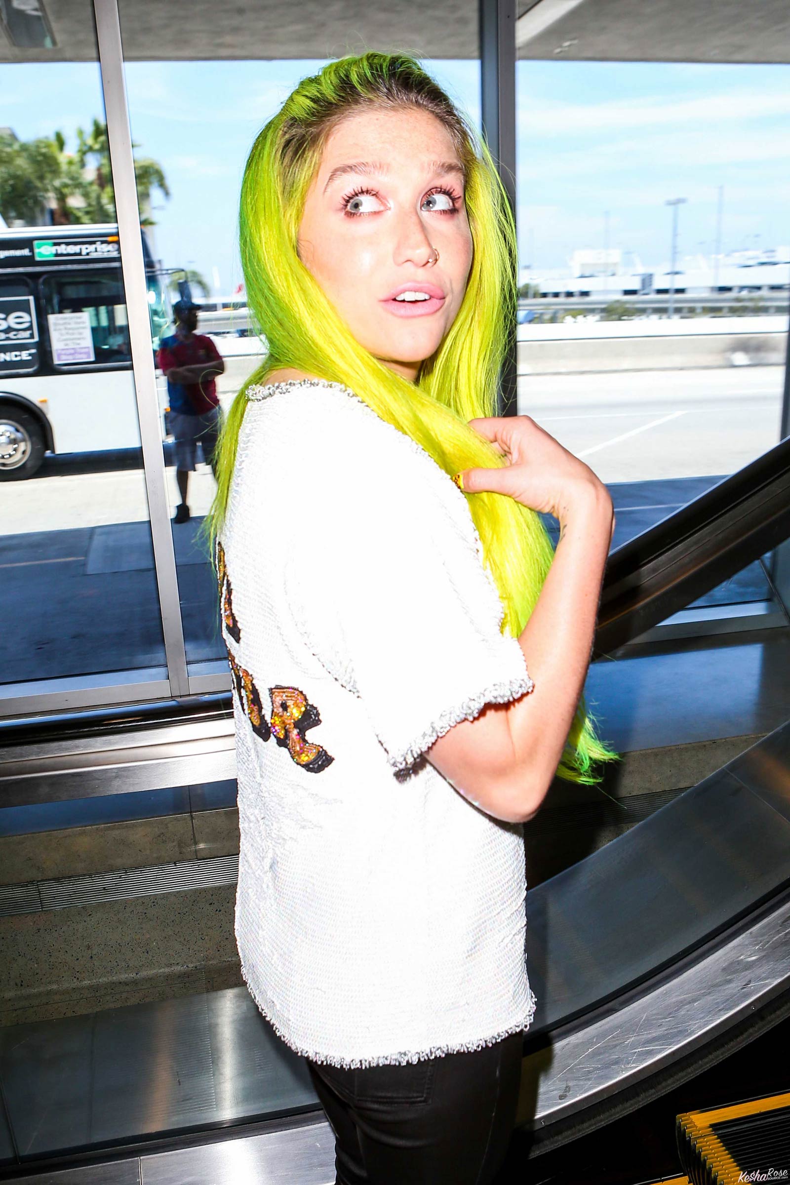 Kesha departing on a flight at LAX airport