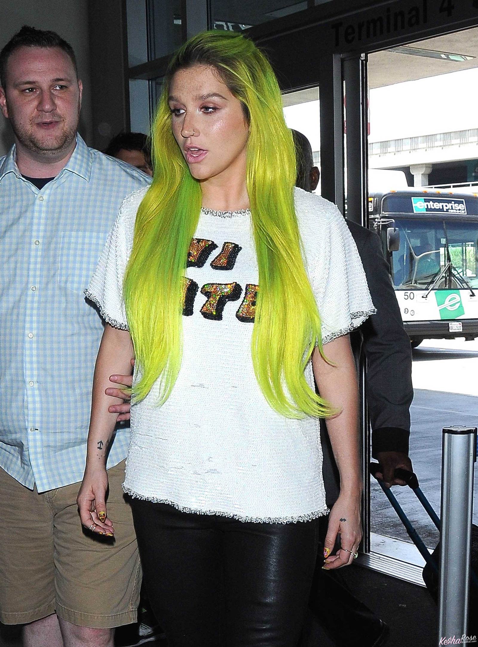 Kesha departing on a flight at LAX airport