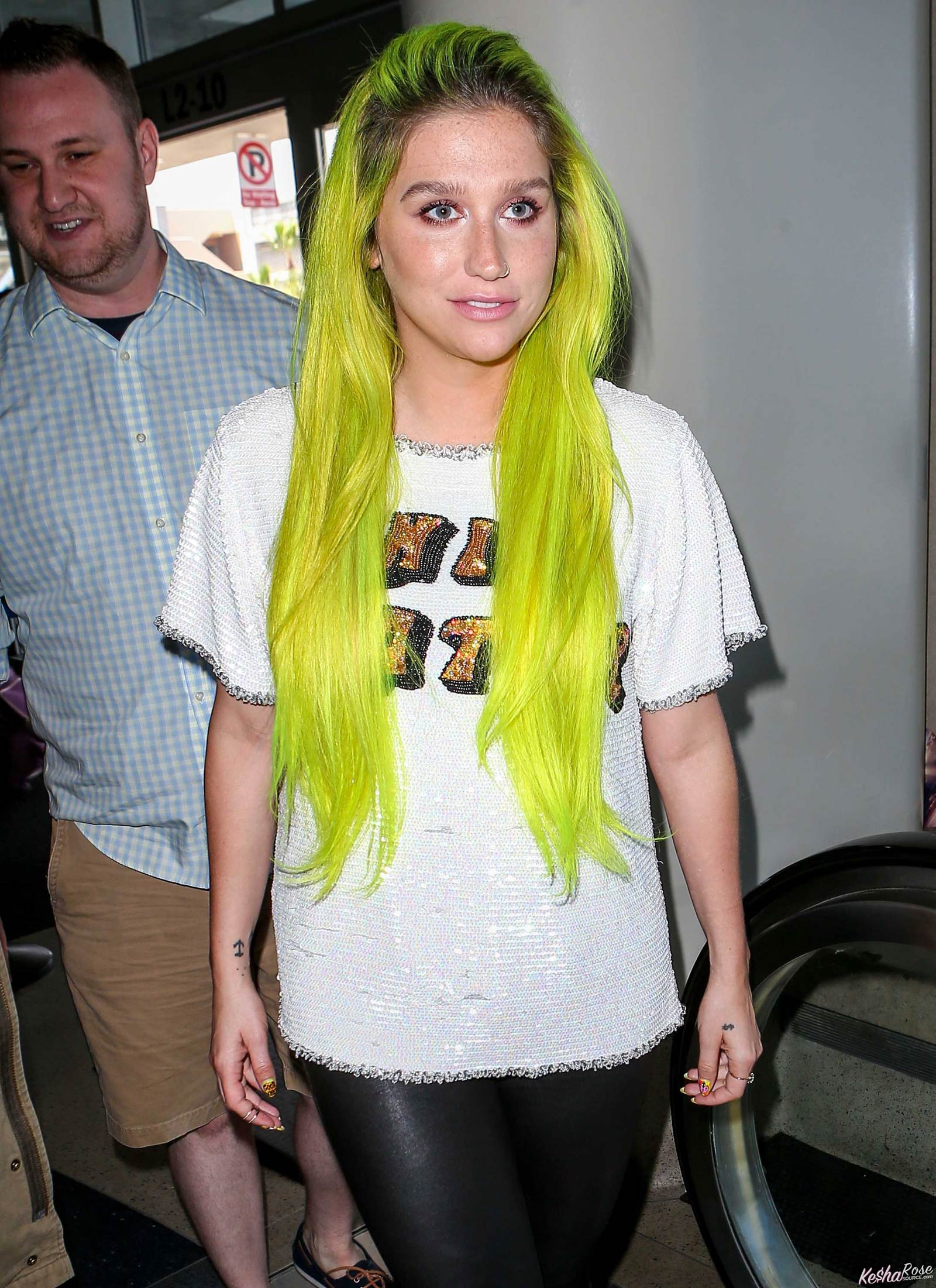 Kesha departing on a flight at LAX airport