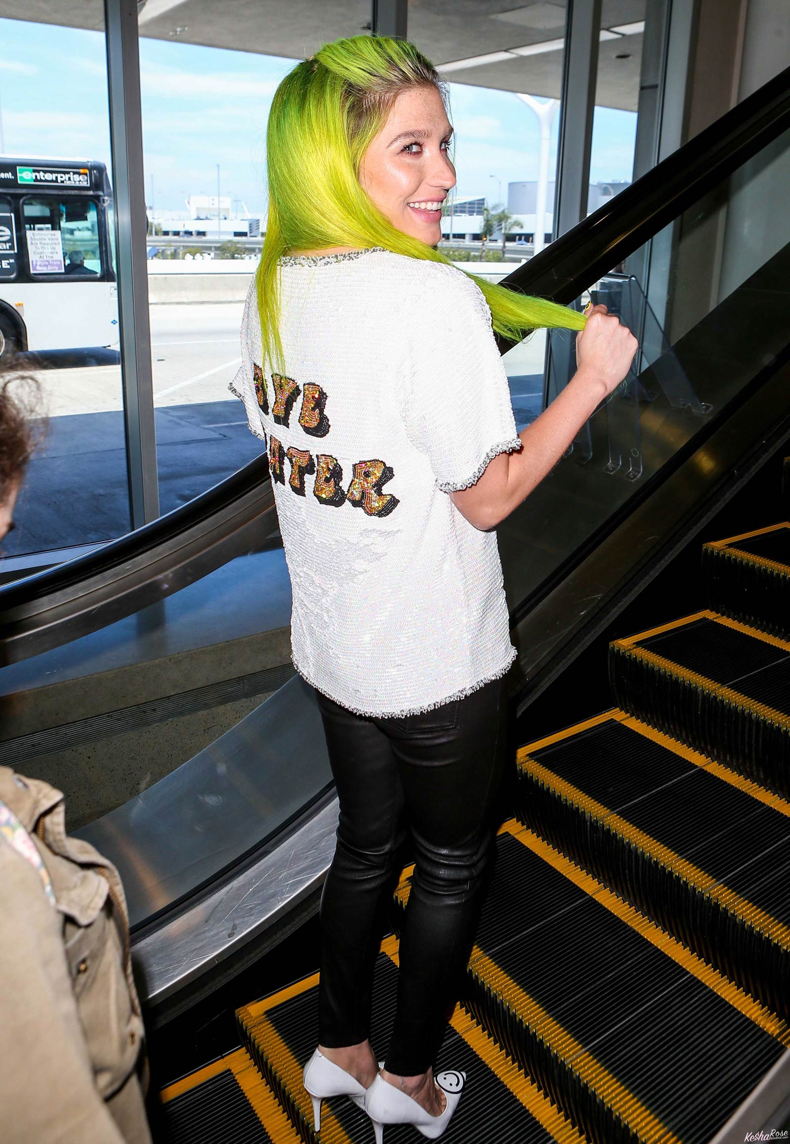 Kesha departing on a flight at LAX airport