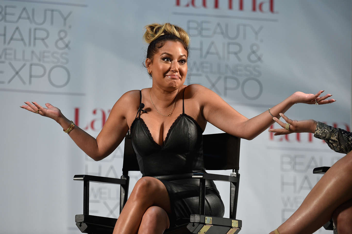 Adrienne Bailon attends the Latina Beauty, Hair & Wellness Expo