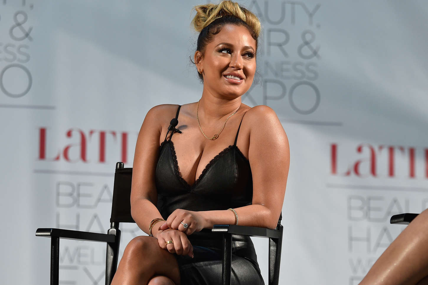 Adrienne Bailon attends the Latina Beauty, Hair & Wellness Expo