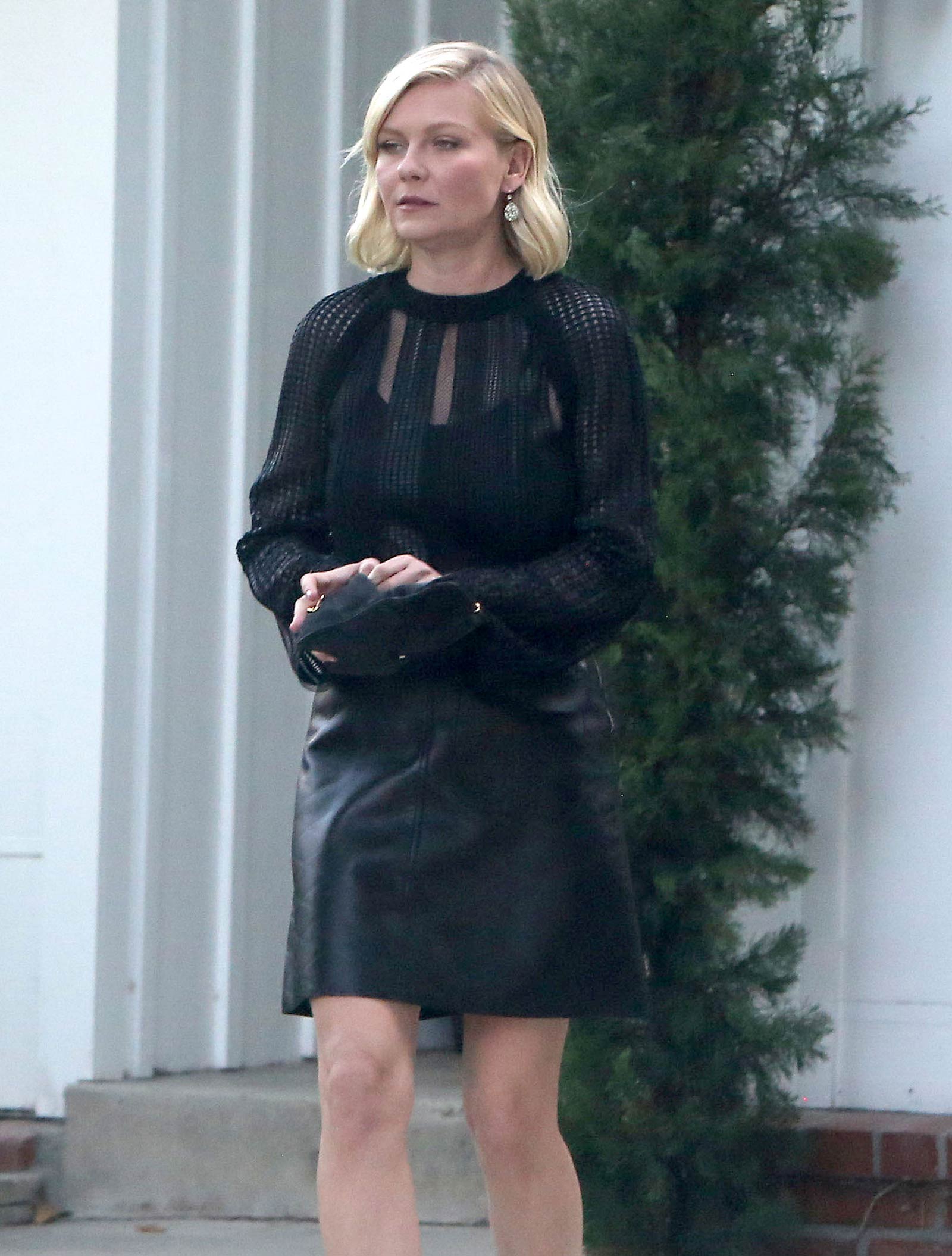 Kirsten Dunst getting into a limo outside her house