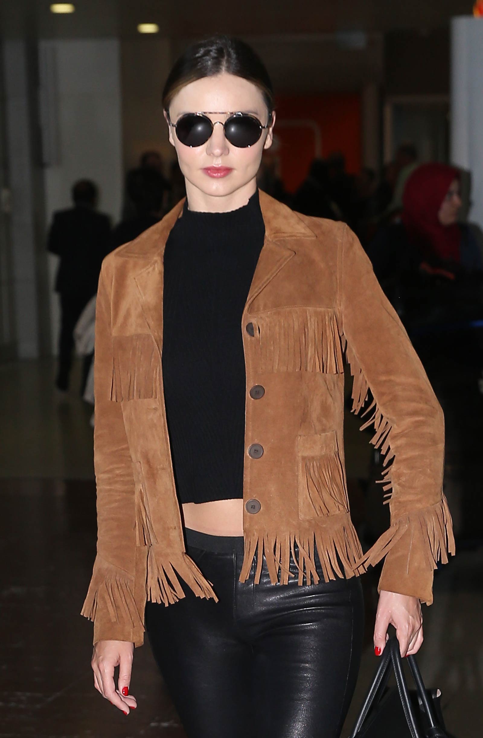 Miranda Kerr arrives at Charles De Gaulle Airport