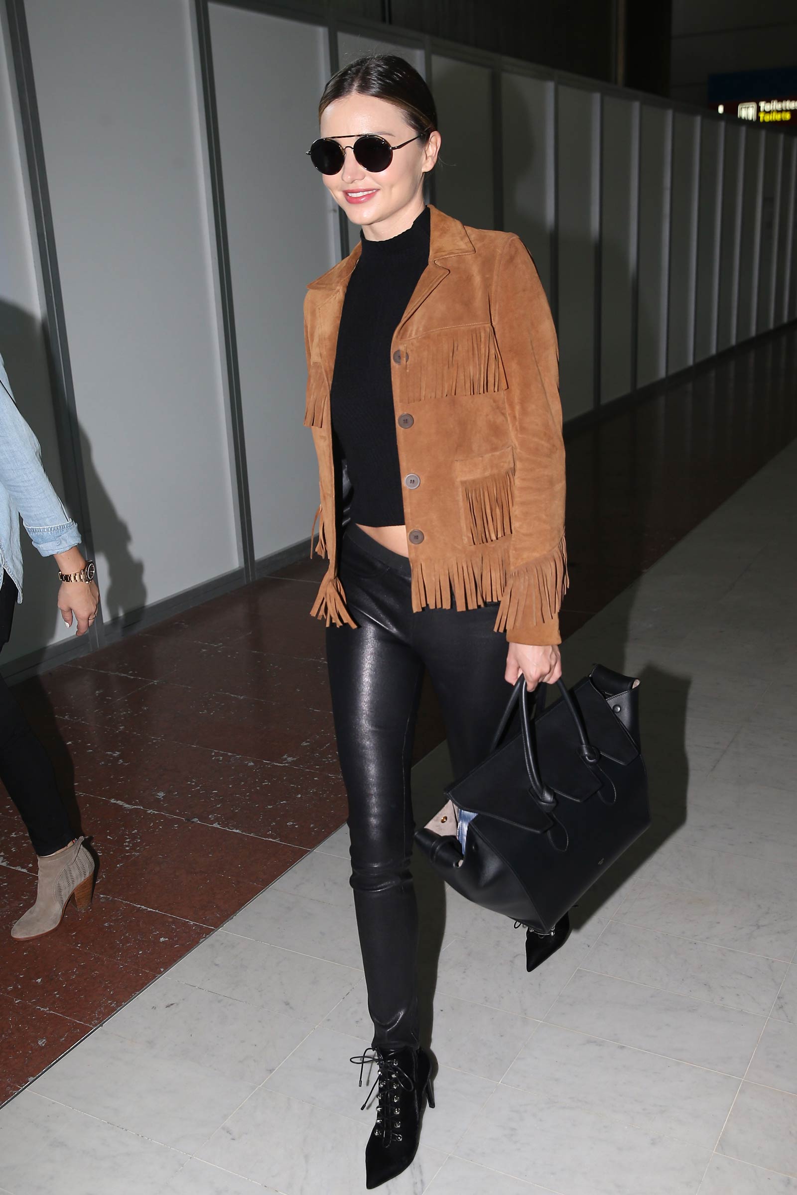 Miranda Kerr arrives at Charles De Gaulle Airport