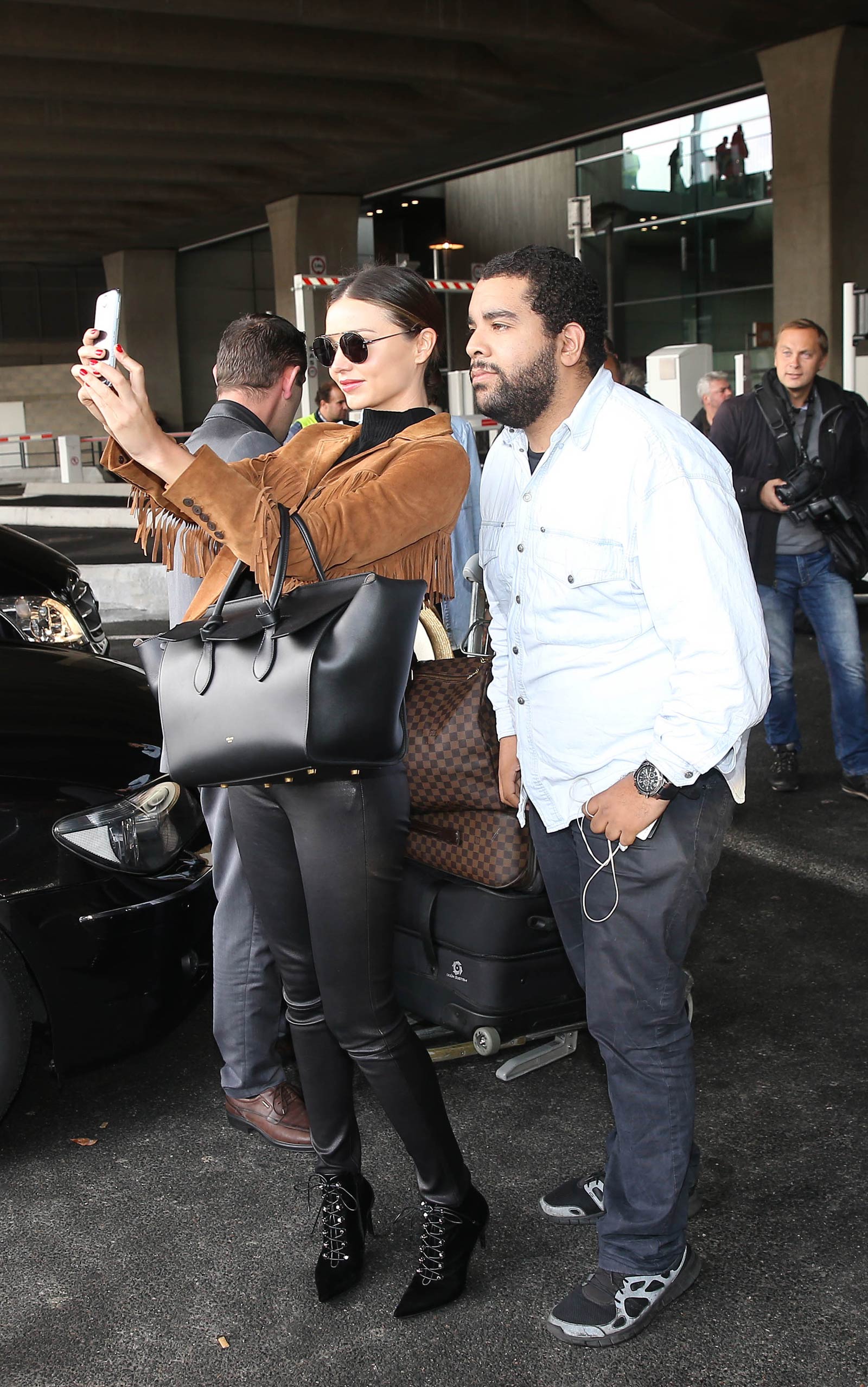 Miranda Kerr arrives at Charles De Gaulle Airport